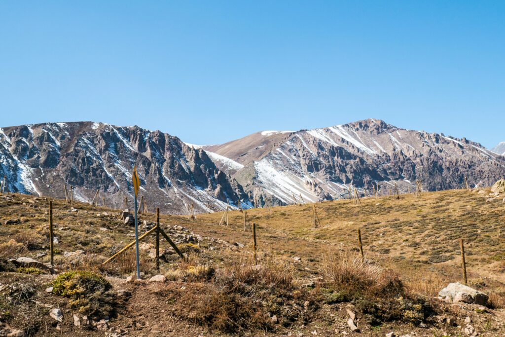 Breathtaking landscape of the Andes Mountains in Las Condes, Chile, with clear blue skies.